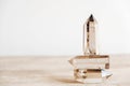 Three smoky natural quartz crystals on a wooden surface on a white background. Copy, empty space for text