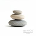 Three smooth, stacked pebbles create a minimalist composition against a white Royalty Free Stock Photo
