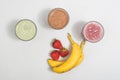 Three smoothie shakes with bananas and strawberries Royalty Free Stock Photo