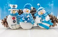 Three Snow Men Ornaments with Pine Cones Royalty Free Stock Photo