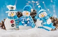 Three Snow Men Ornaments with Snow