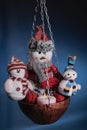 Three snowmen warming themselves by the hearth from candle Royalty Free Stock Photo