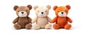 Three soft toy bears sitting in a row on white background Royalty Free Stock Photo