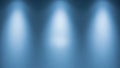 Three Softly Glowing White Spotlights Shining Down on a Textured Blue Wall Background Keywords: spotlights, light Royalty Free Stock Photo