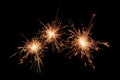 Three sparklers firework on black background. Christmas celebration Royalty Free Stock Photo