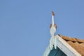 Three sparrows on roof decoration