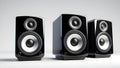 Three speakers positioned in front of a plain white background. Royalty Free Stock Photo