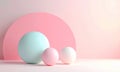 Three spheres of different sizes and pastel colors are arranged on a pink surface. Royalty Free Stock Photo