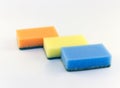 Three sponges for washing dishes on white background Royalty Free Stock Photo