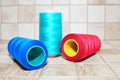 Three spools of thread. Navy, red and blue