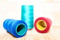 Three spools of thread. Navy, red and blue