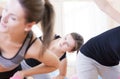 Three Sportive Caucasian Active Women Doing Stretching Exercises with Barbells in Gym Royalty Free Stock Photo