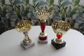 Three sports cups on white table