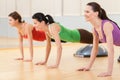 Three sporty women doing exercise on ball. Royalty Free Stock Photo