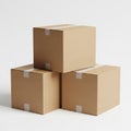 Three stacked brown cardboard boxes on a white surface Royalty Free Stock Photo