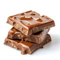 Three stacked pieces of milk chocolate, partially melted, are arranged on a white Royalty Free Stock Photo