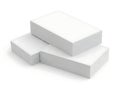 Three stacked white rectangular blocks on a plain surface Royalty Free Stock Photo