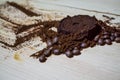 Three stages for preparation of coffee: grain, crushing and the pressed tablet. Wooden surface. Espresso. Work barista.