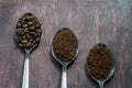 Three stages of spoons in coffee - beans, ground, instant Royalty Free Stock Photo