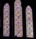 Three stained glass windows in a church
