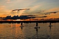 Three stand-up paddler at Lake Starnberg, Bavaria, at sunset