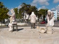 Three statues in homage to the women working at the cannery factory