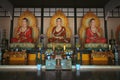 Three statues of meditating Buddha