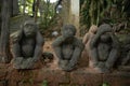 Three statues of monkeys.