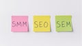 three sticky notes displaying smm, seo, and sem Royalty Free Stock Photo