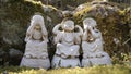 Stone figures of buddha acting like three wise monkeys Mizaru, Kikazaru, Iwazaru