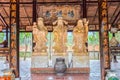 Three stone statues bearing symbol `Blessing, fortune, expectancy`