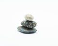 Three stones are stacked isolated on white background. Zen stone