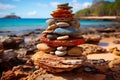 Three stones stacked on seashore with clear sky and beautiful light and shadow composition Royalty Free Stock Photo