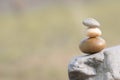 Three stones standing on one another symbolize balance