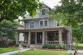 Three-storey beautiful expensive house surrounded by green lawn and trees