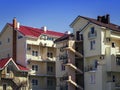 Three-storey hotel decorated with beige siding