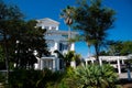 Three-story houses with white pergola and picket fence curb appeal along scenic 30A country road in Santa Rosa, South Walton, Royalty Free Stock Photo