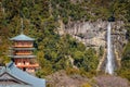 Three story pagoda of Seiganto-ji Tendai Buddhist temple in Wakayama Prefecture, Japan with Nachi Falls Royalty Free Stock Photo