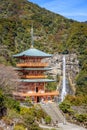 Three story pagoda of Seiganto-ji Tendai Buddhist temple in Wakayama Prefecture, Japan with Nachi Falls Royalty Free Stock Photo