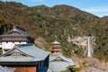 Three story pagoda of Seiganto-ji Tendai Buddhist temple in Wakayama Prefecture, Japan with Nachi Falls Royalty Free Stock Photo