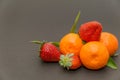 Three strawberries and Mandarins mandarin, tangerines!Very sweet and tasty citrus