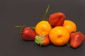 Three strawberries and Mandarins mandarin, tangerines!Very sweet and tasty citrus