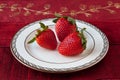 Three Strawberries on a Plate Royalty Free Stock Photo