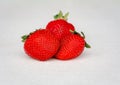 Three strawberries on white background Royalty Free Stock Photo