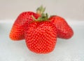 Three strawberries on white background Royalty Free Stock Photo