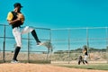Three strikes and youre out. a young baseball player getting ready to pitch the ball during a game outdoors. Royalty Free Stock Photo