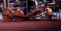 three stringed musical instruments cello lie on the stage Royalty Free Stock Photo