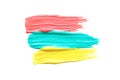 Three strokes of red, blue and yellow thick acrylic paint. place for text. Royalty Free Stock Photo