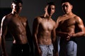 Three strong and fit latin men bodybuilders. Sports and fitness motivation.