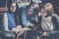 Three students girls studying together at home. Royalty Free Stock Photo